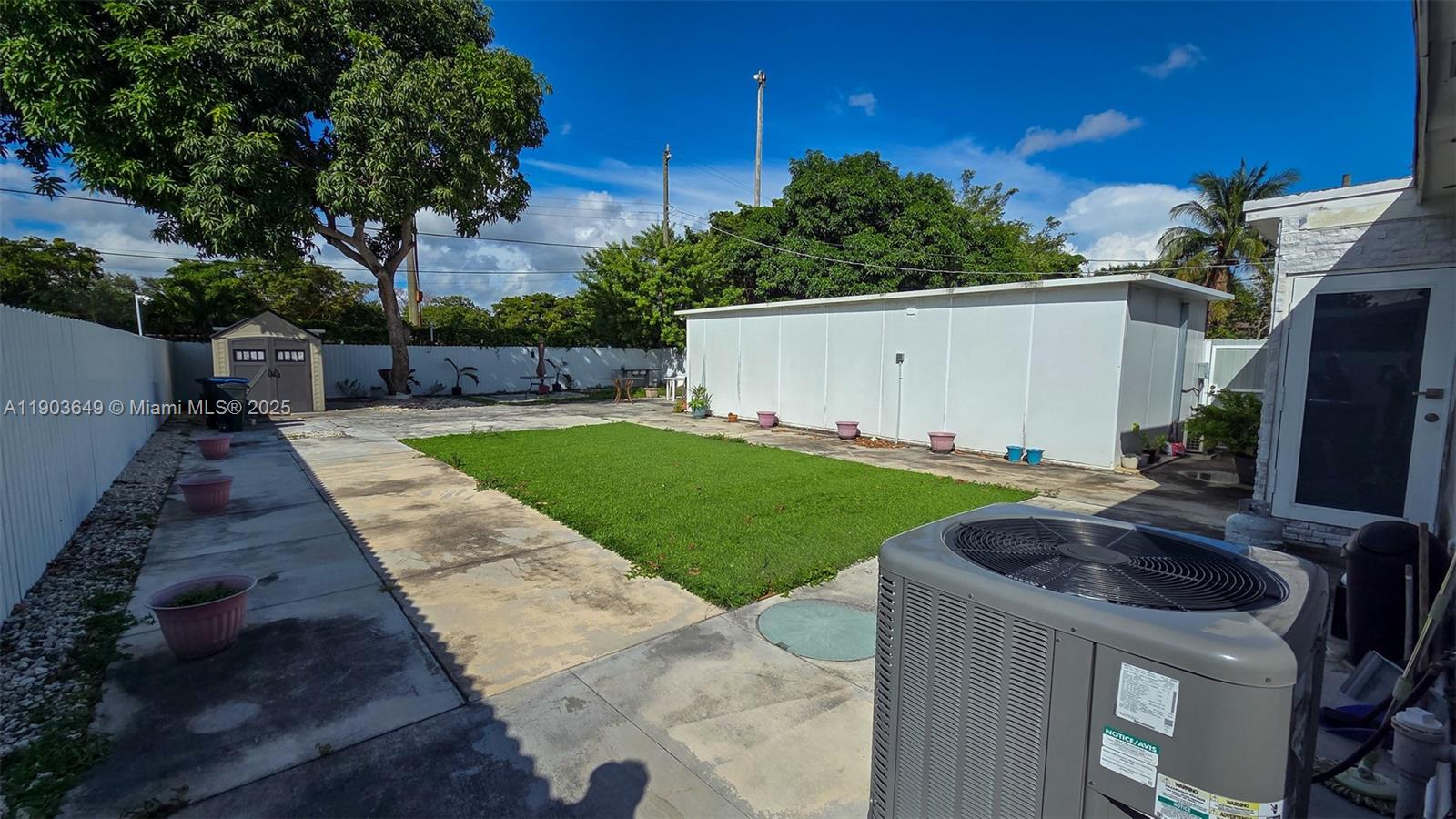 1545 Northwest 85th Street Miami, FL 33147 - Photo 13 of 16 a view of backyard with swimming pool and outdoor seating