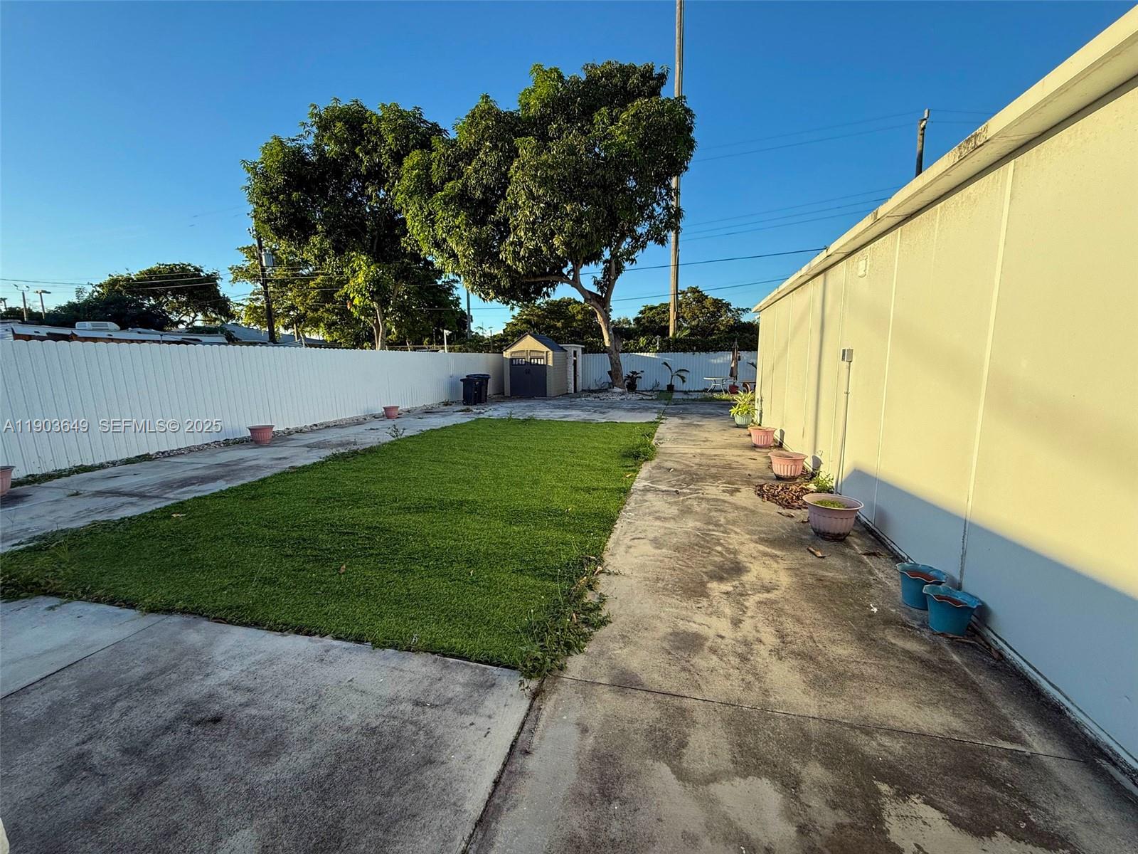 1545 Northwest 85th Street Miami, FL 33147 - Photo 14 of 16 a view of a back yard with green space