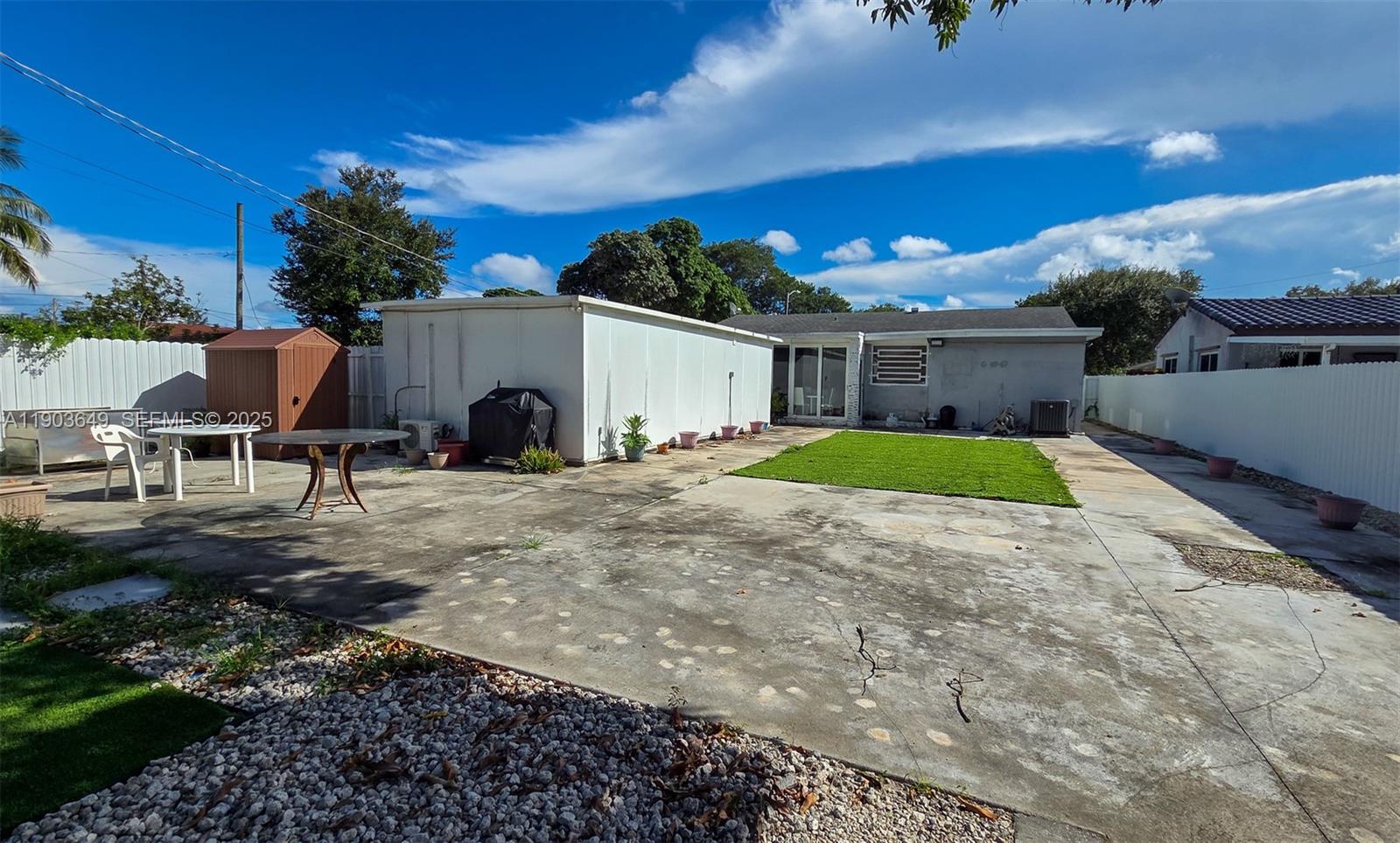 1545 Northwest 85th Street Miami, FL 33147 - Photo 15 of 16 a view of a house with backyard and sitting area