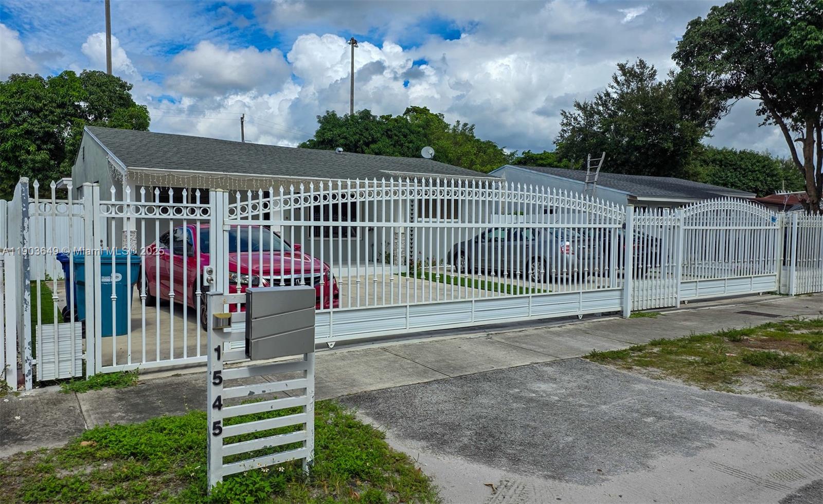 1545 Northwest 85th Street Miami, FL 33147 - Photo 2 of 16 a view of a wrought iron fences in front of house
