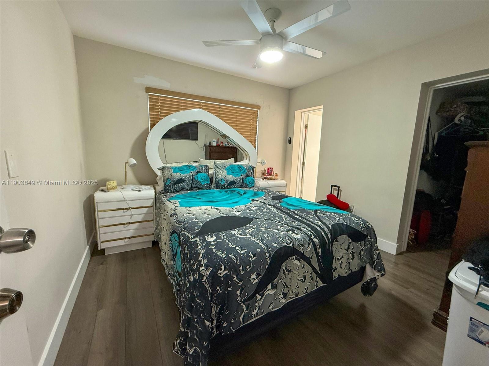 1545 Northwest 85th Street Miami, FL 33147 - Photo 7 of 16 a bedroom with a bed and a mirror