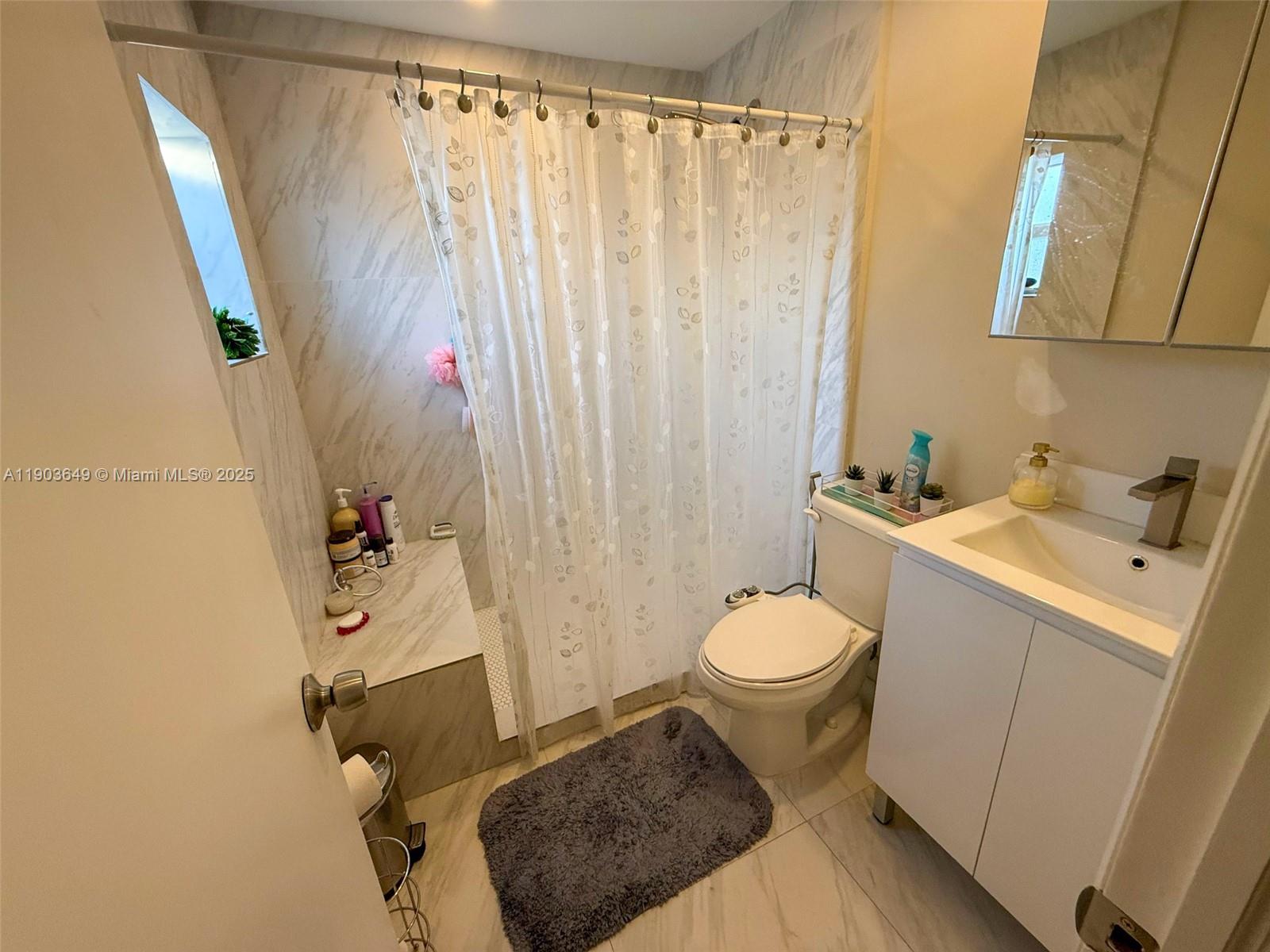 1545 Northwest 85th Street Miami, FL 33147 - Photo 8 of 16 a bathroom with a sink toilet and shower