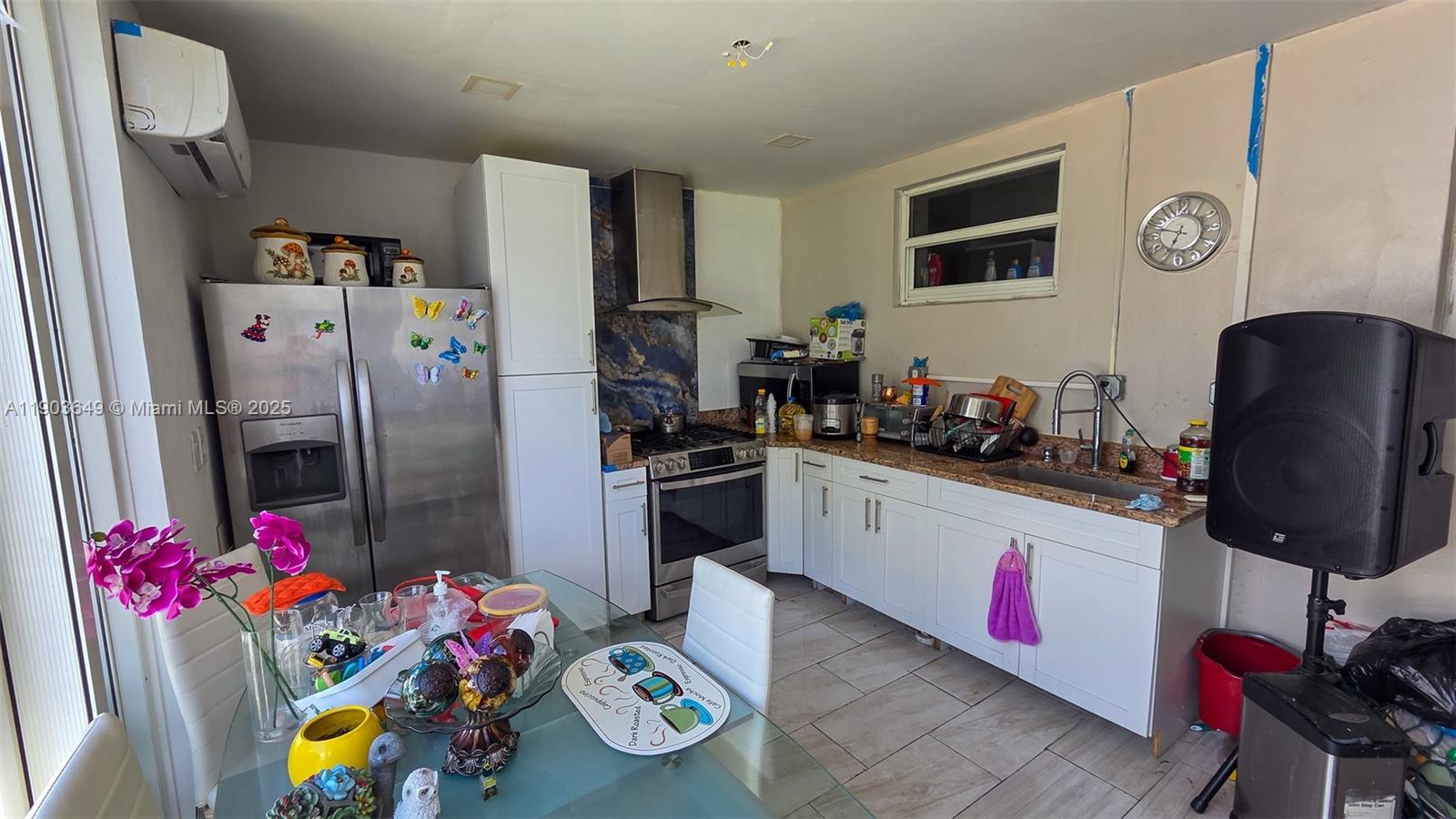 1545 Northwest 85th Street Miami, FL 33147 - Photo 9 of 16 a kitchen with a refrigerator and a stove top oven