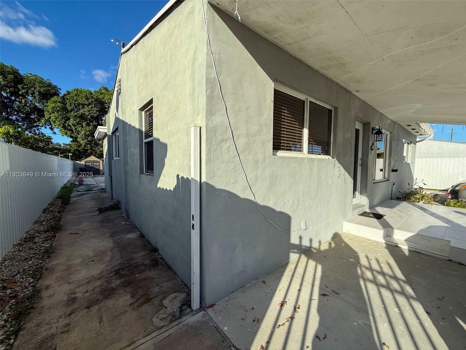 1545 Northwest 85th Street Miami, FL 33147 - Photo 10 of 16 a view of a house with backyard