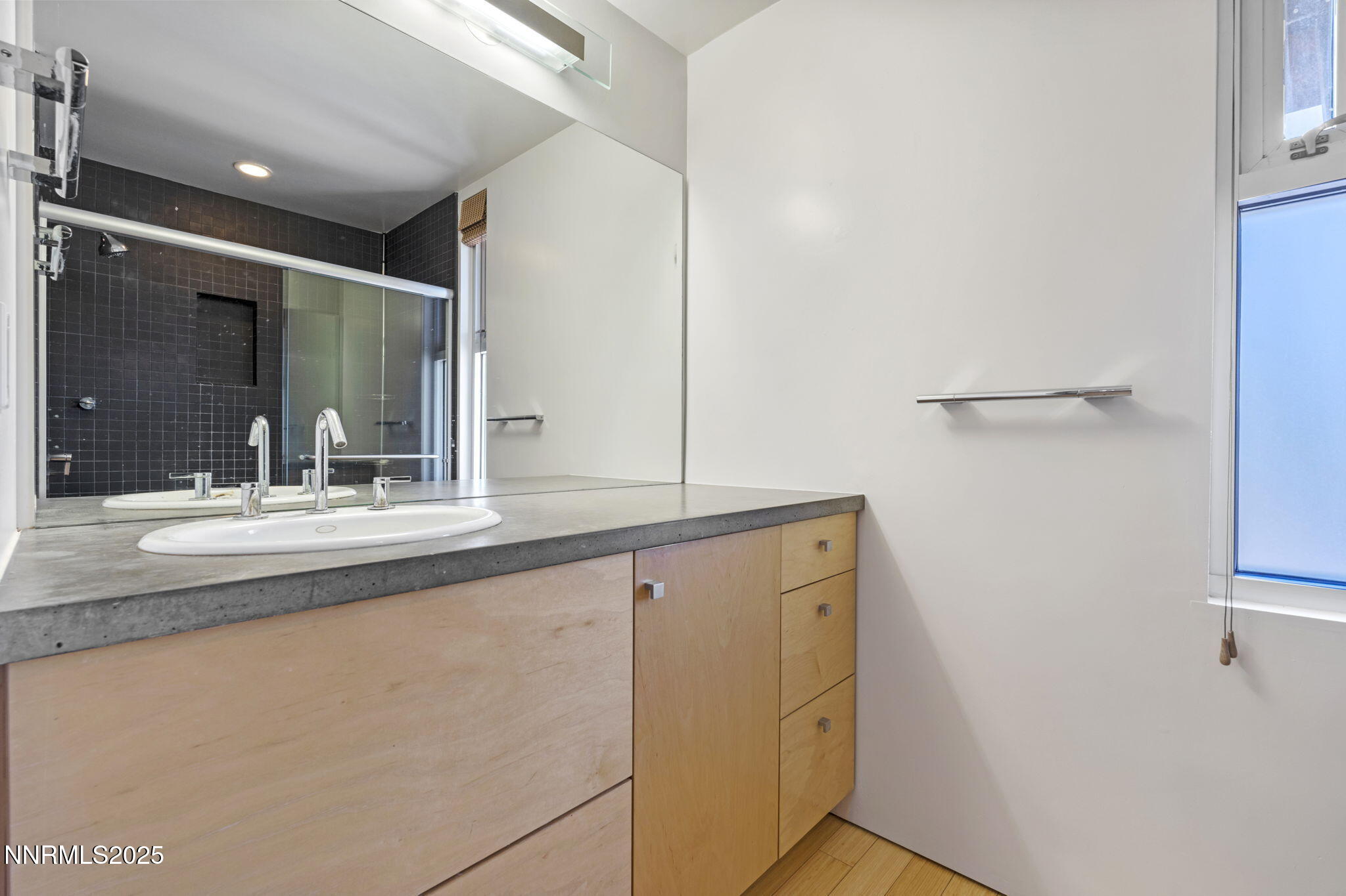 880 South Center Street Reno, NV 89501 - Photo 17 of 54 a bathroom with a sink and mirror