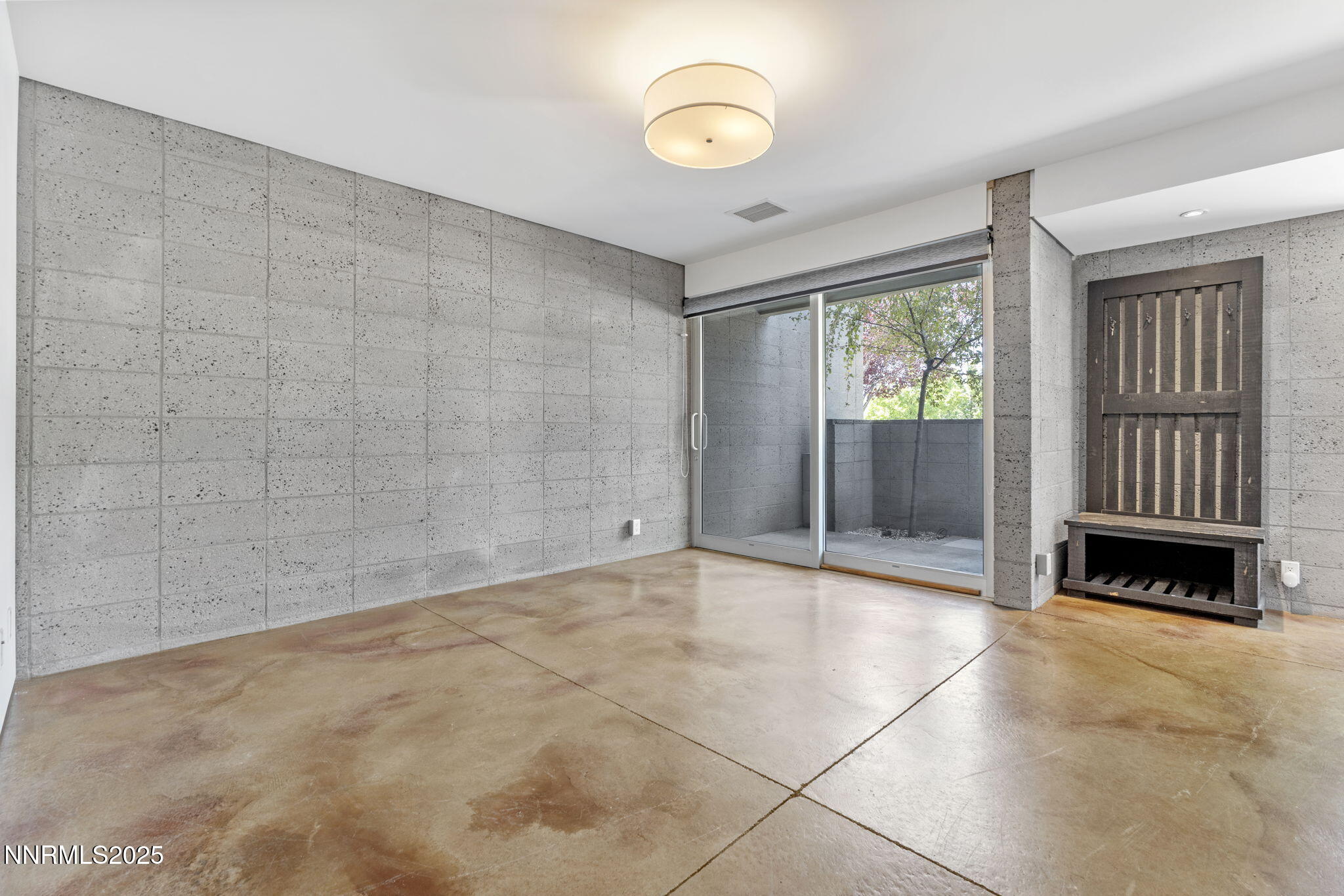 880 South Center Street Reno, NV 89501 - Photo 3 of 54 a view of an empty room with a fireplace and a window