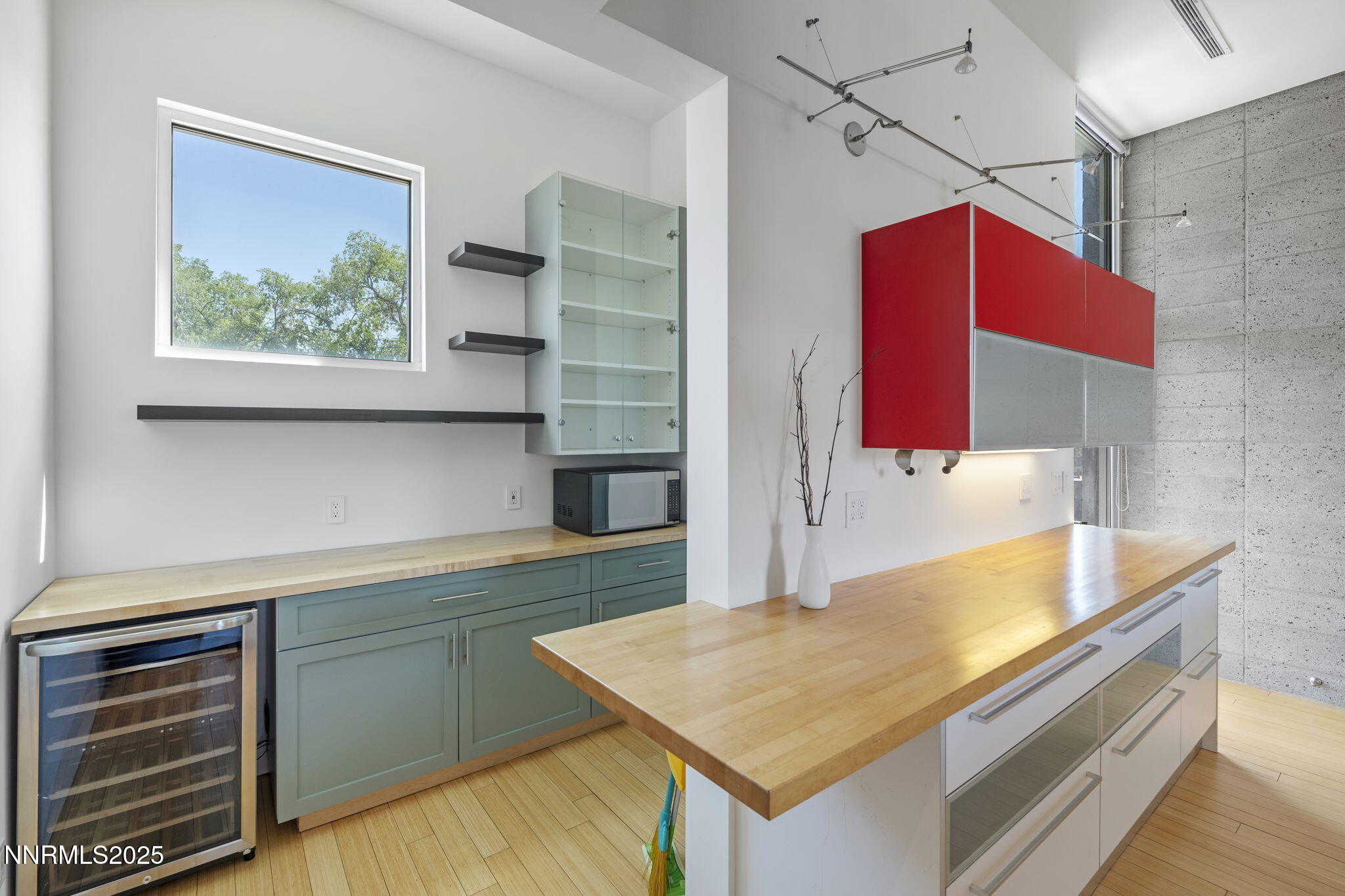 880 South Center Street Reno, NV 89501 - Photo 32 of 54 a kitchen with a sink a counter space and wooden floor