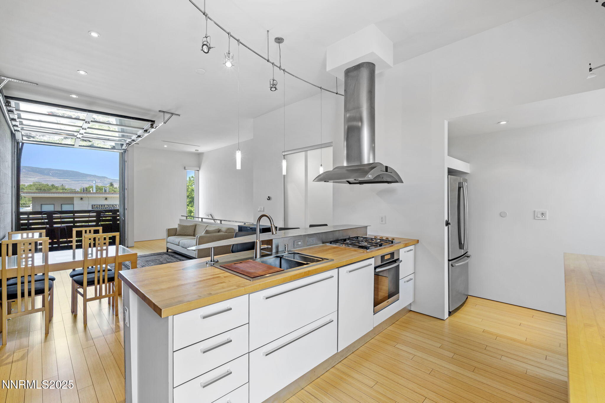 880 South Center Street Reno, NV 89501 - Photo 38 of 54 a kitchen with a sink a stove and chairs