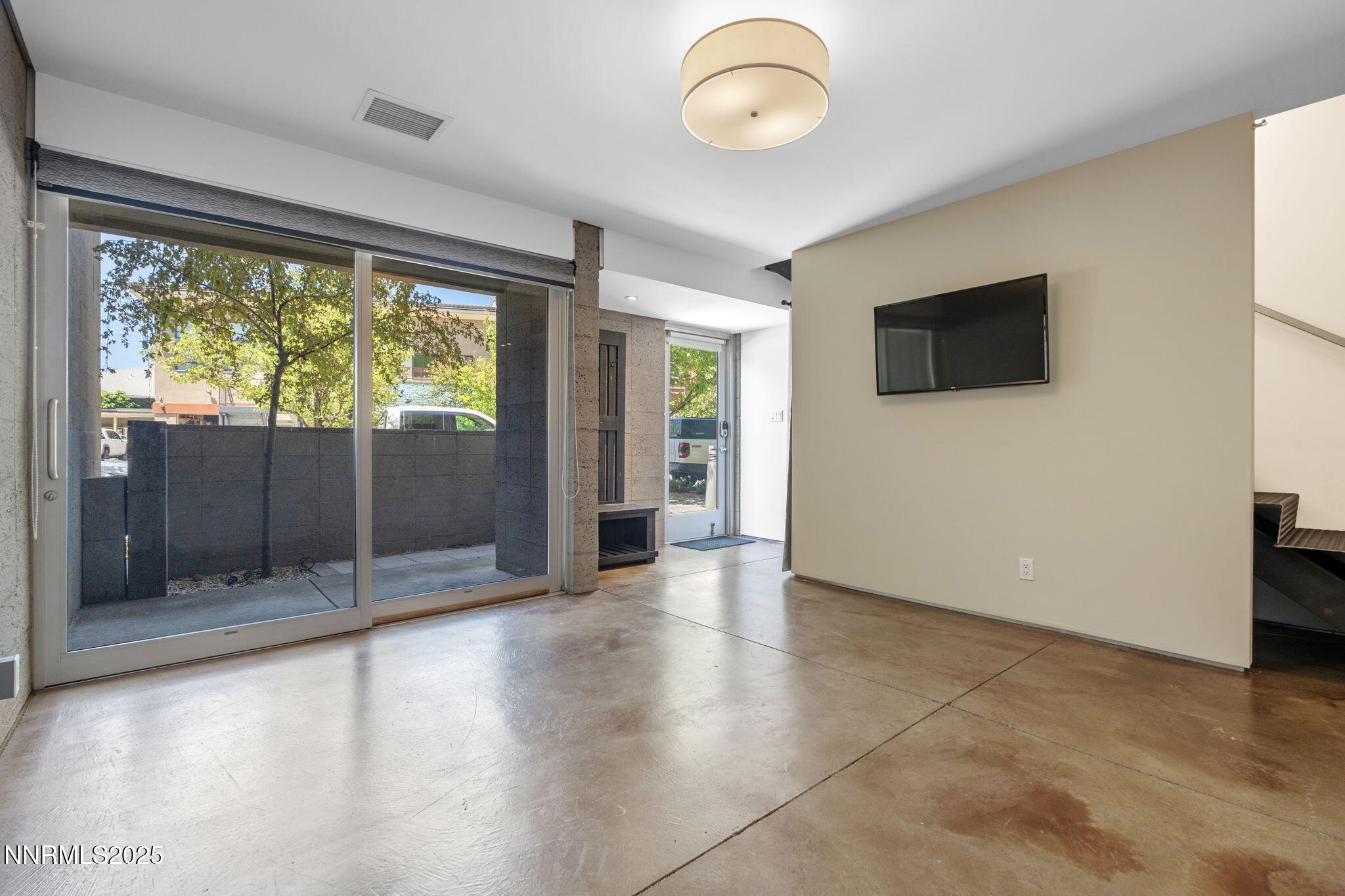 880 South Center Street Reno, NV 89501 - Photo 5 of 54 an empty room with wooden floor and windows