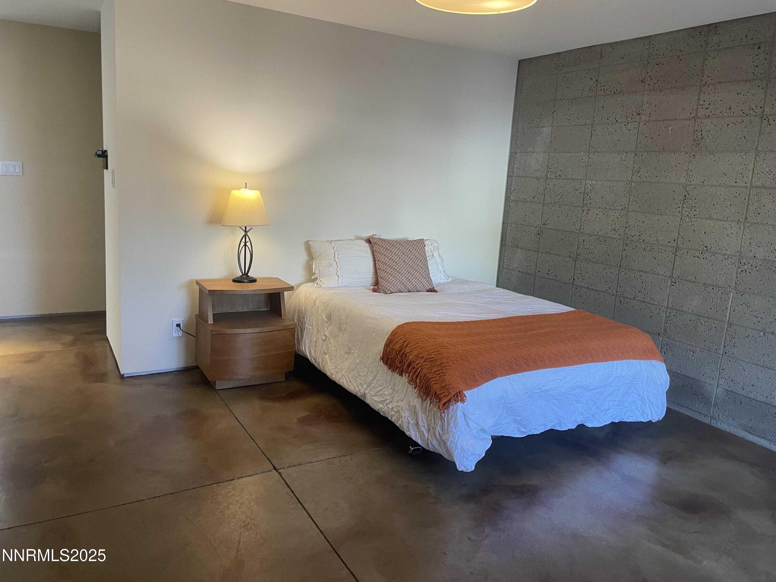 880 South Center Street Reno, NV 89501 - Photo 8 of 54 a bedroom with a bed and a lamp