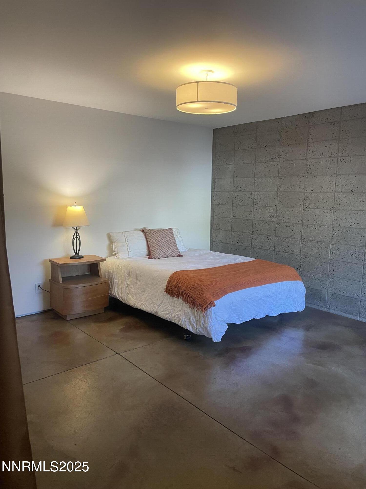 880 South Center Street Reno, NV 89501 - Photo 9 of 54 a bedroom with a bed and a lamp