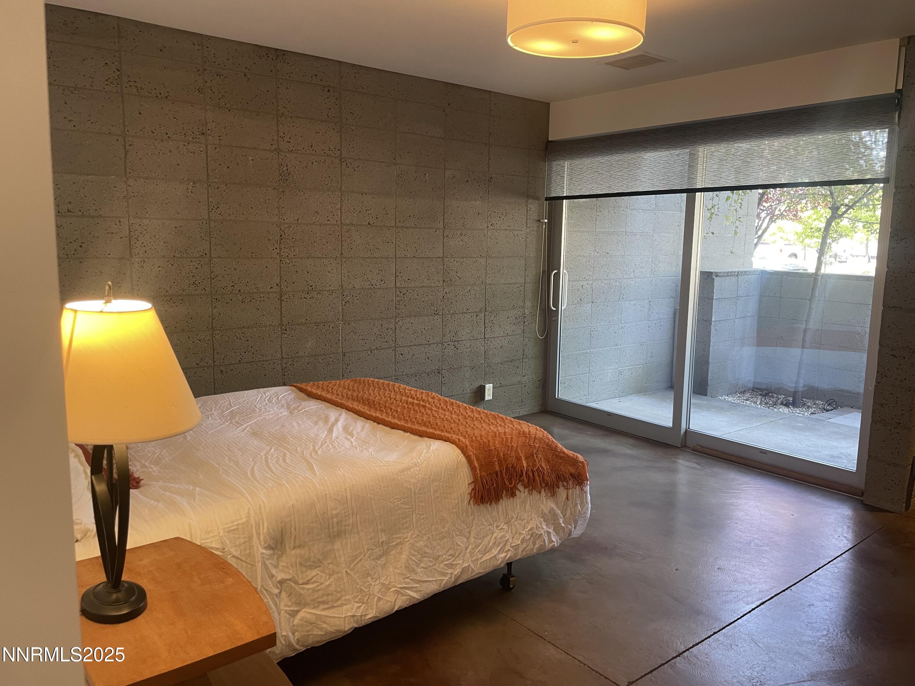 880 South Center Street Reno, NV 89501 - Photo 10 of 54 a bedroom with a bed and lamp on the table