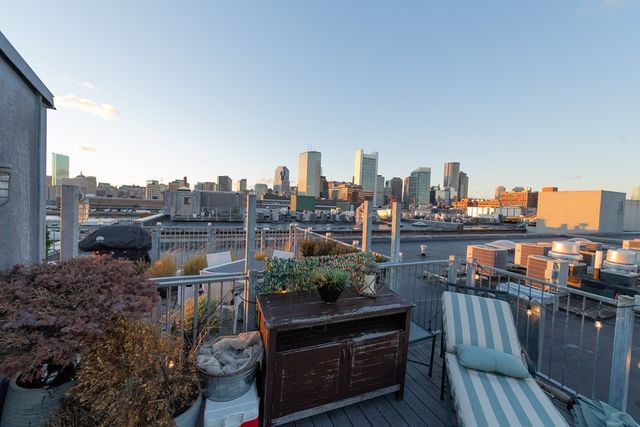 a view of city and a lake from a balcony