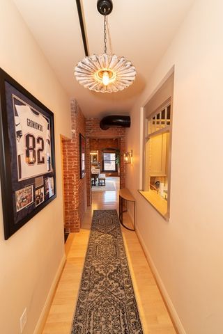 a view of a hallway with a chandelier