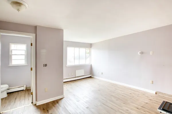 a white toilet sitting next to a bathroom sink