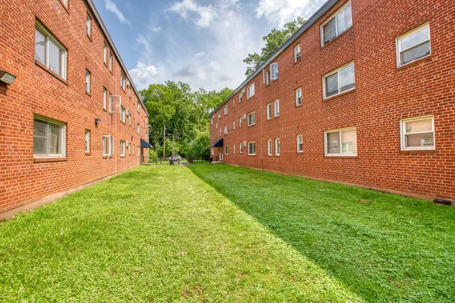 a view of a building with a yard