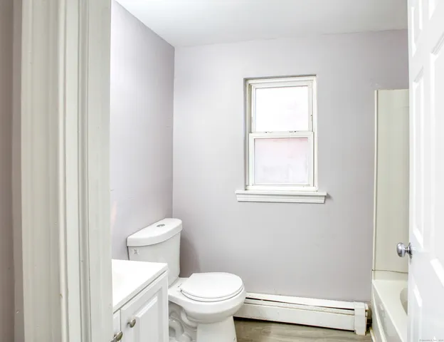 a kitchen with granite countertop cabinets stainless steel appliances a sink and a window