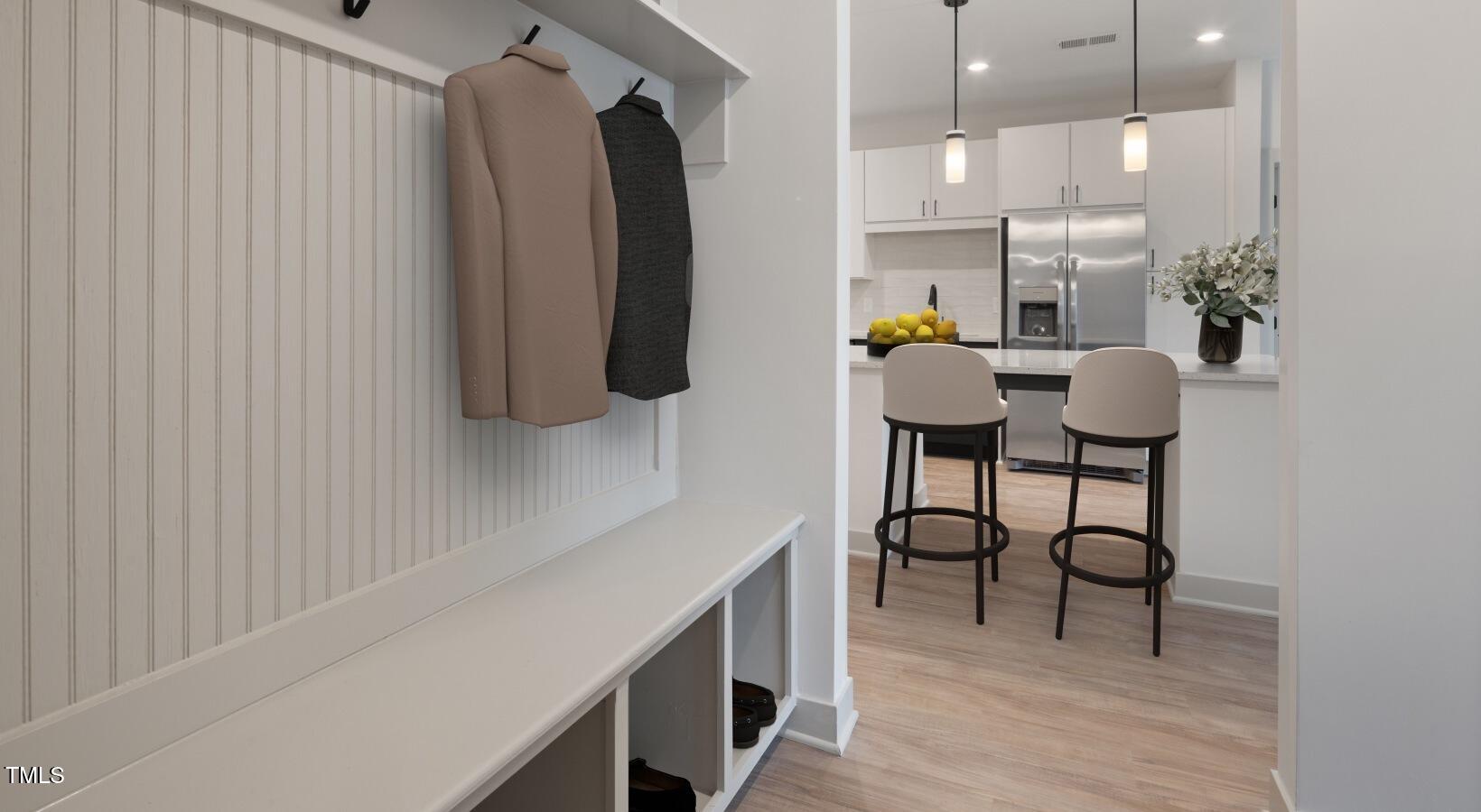 1821 Chatham Flats Drive, Unit A1 Apex, NC 27502 - Photo 11 of 12 a view of kitchen with furniture and wooden floor