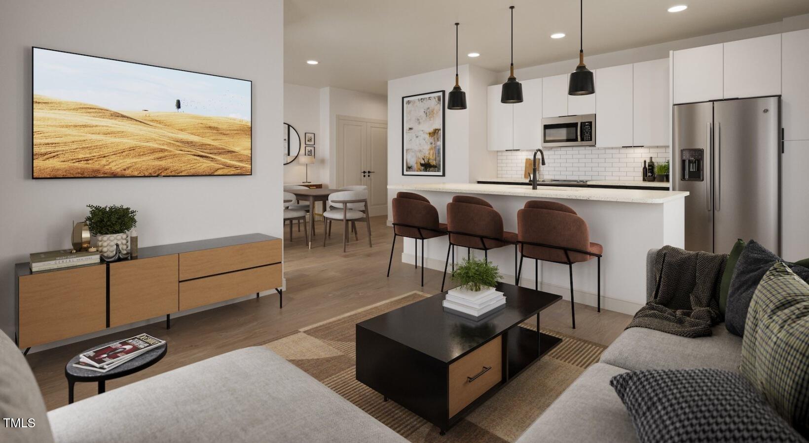 1821 Chatham Flats Drive, Unit A1 Apex, NC 27502 - Photo 7 of 12 a living room with furniture and kitchen view
