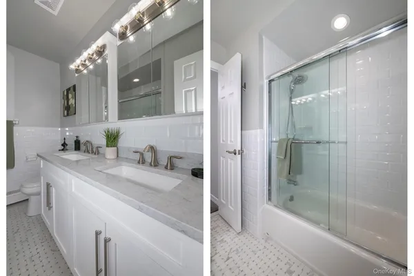 a bathroom with a granite countertop sink a mirror and a bathtub