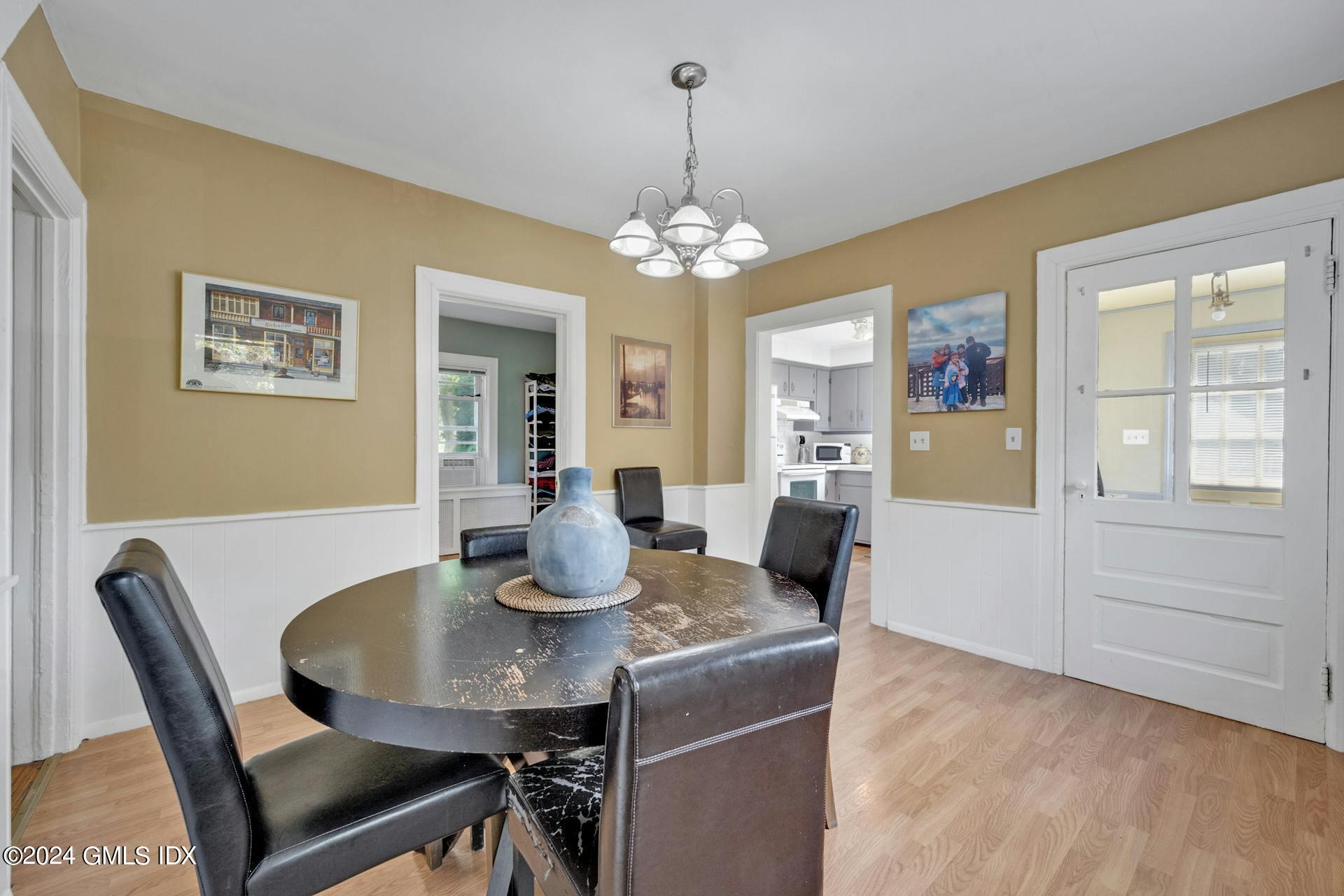 334 Palmer Hill Road Riverside, CT 06878 - Photo 11 of 19 a view of a dining room with furniture and chandelier