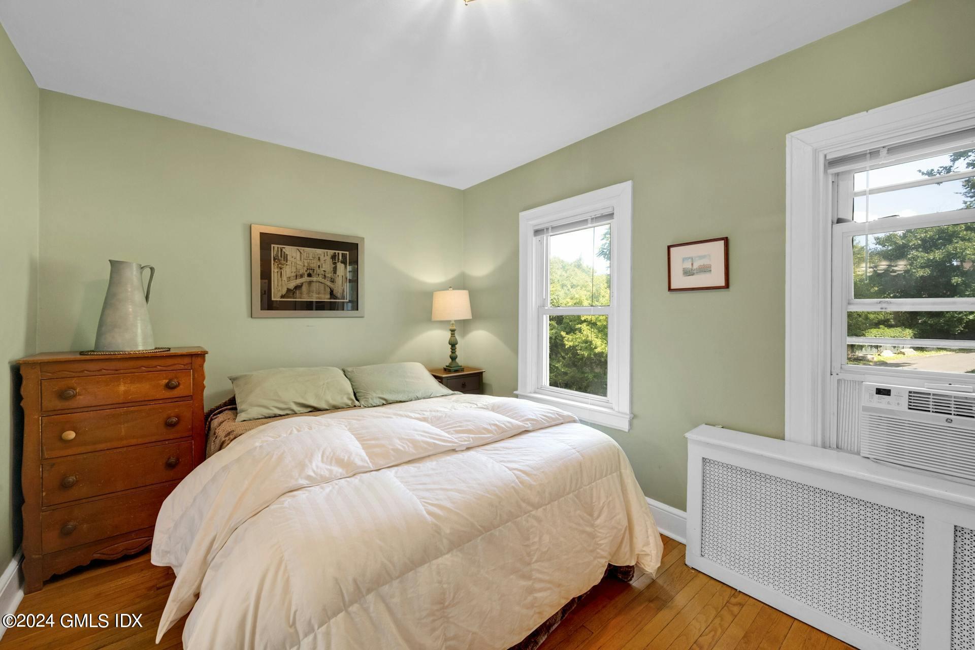 334 Palmer Hill Road Riverside, CT 06878 - Photo 13 of 19 a bedroom with a bed and a dresser