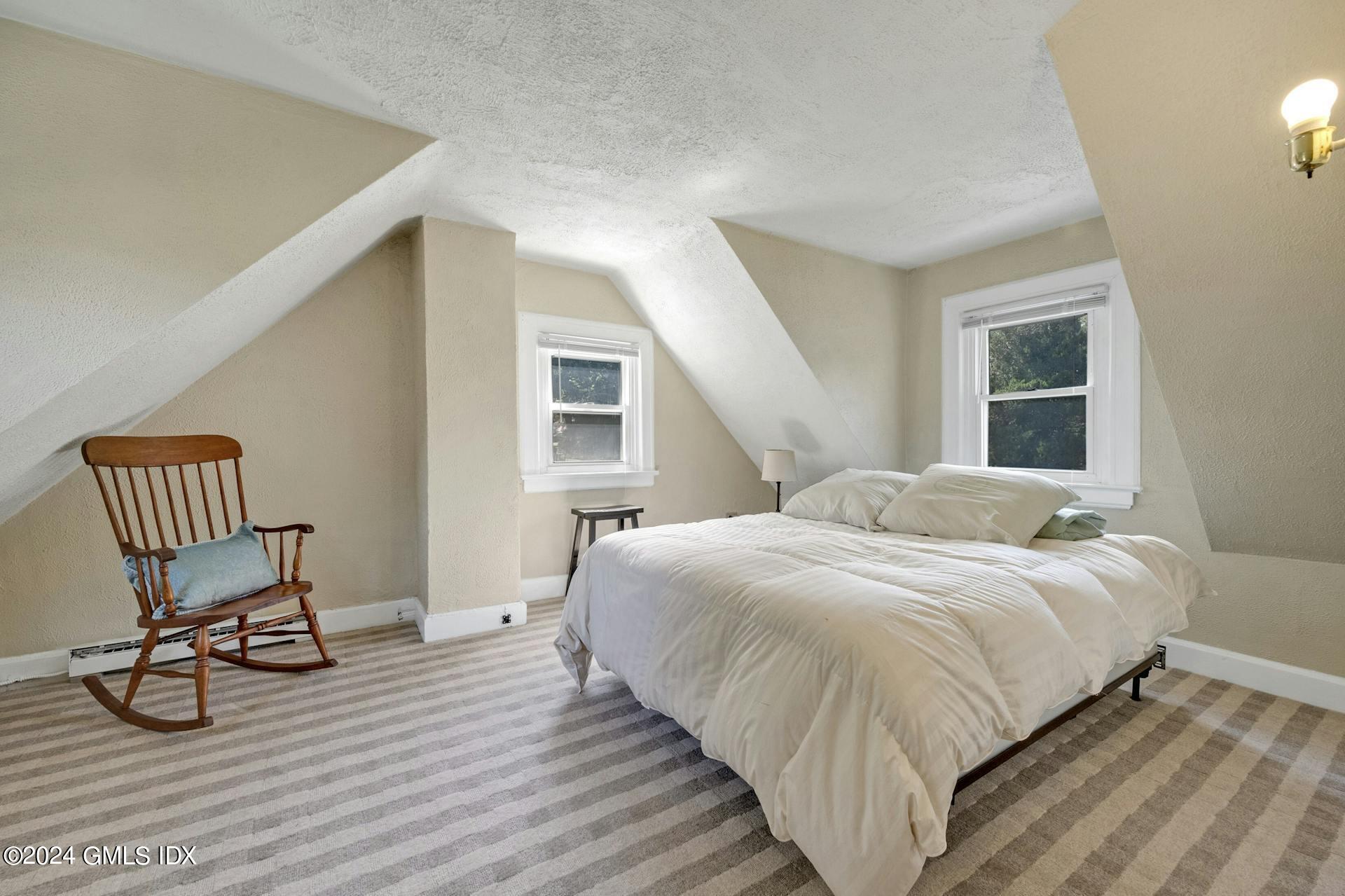 334 Palmer Hill Road Riverside, CT 06878 - Photo 17 of 19 a bedroom with a bed and chair