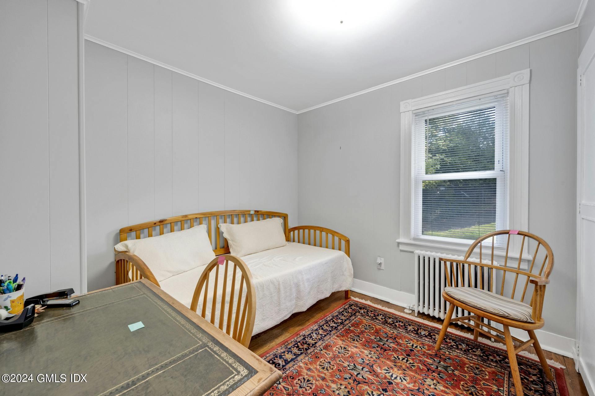 334 Palmer Hill Road Riverside, CT 06878 - Photo 4 of 19 a bedroom with a bed and a window