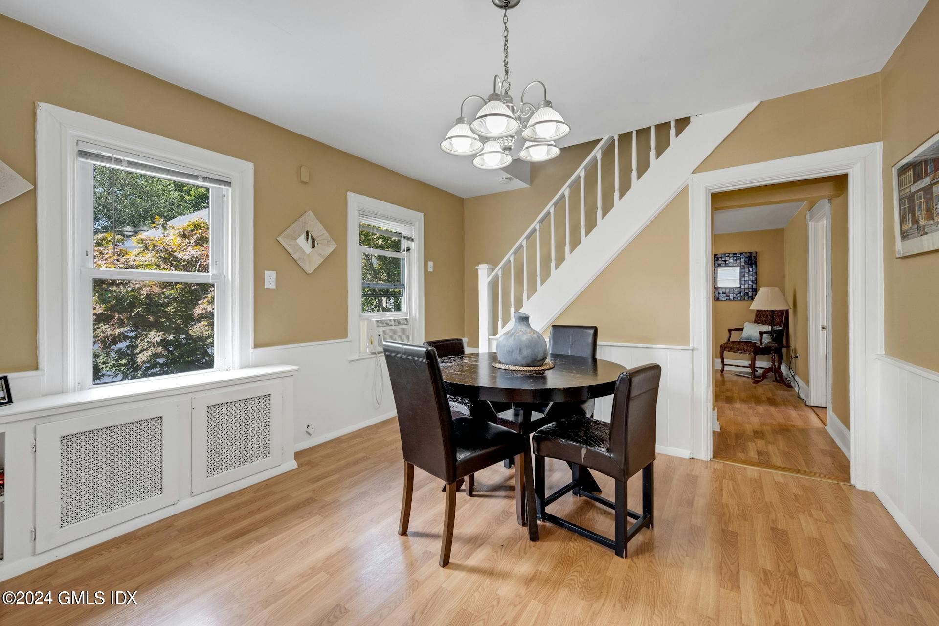 334 Palmer Hill Road Riverside, CT 06878 - Photo 10 of 19 a view of a dining room with furniture wooden floor and chandelier