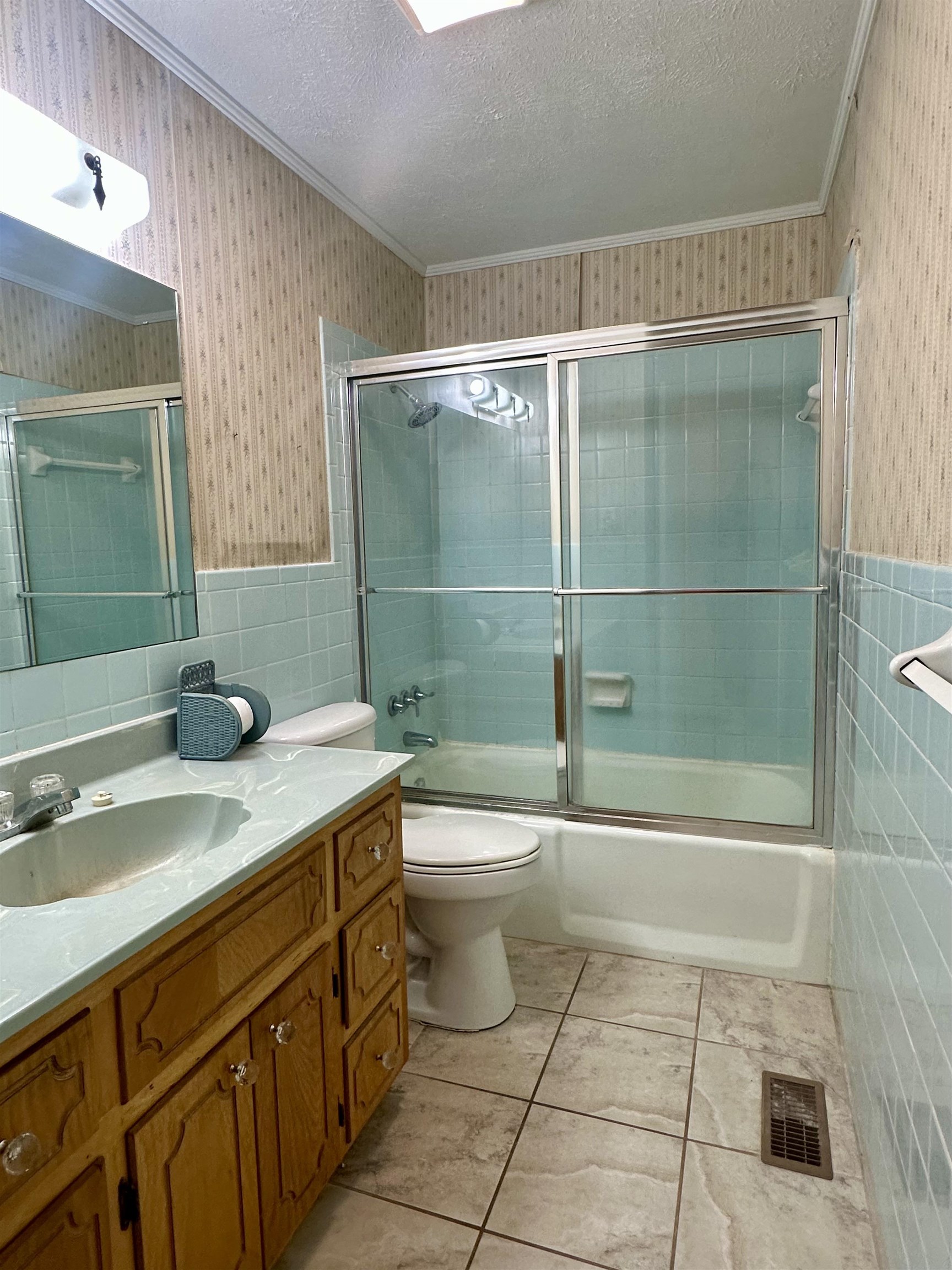 136 Perkins Street Selmer, TN 38375 - Photo 15 of 25 a bathroom with a sink a toilet and shower