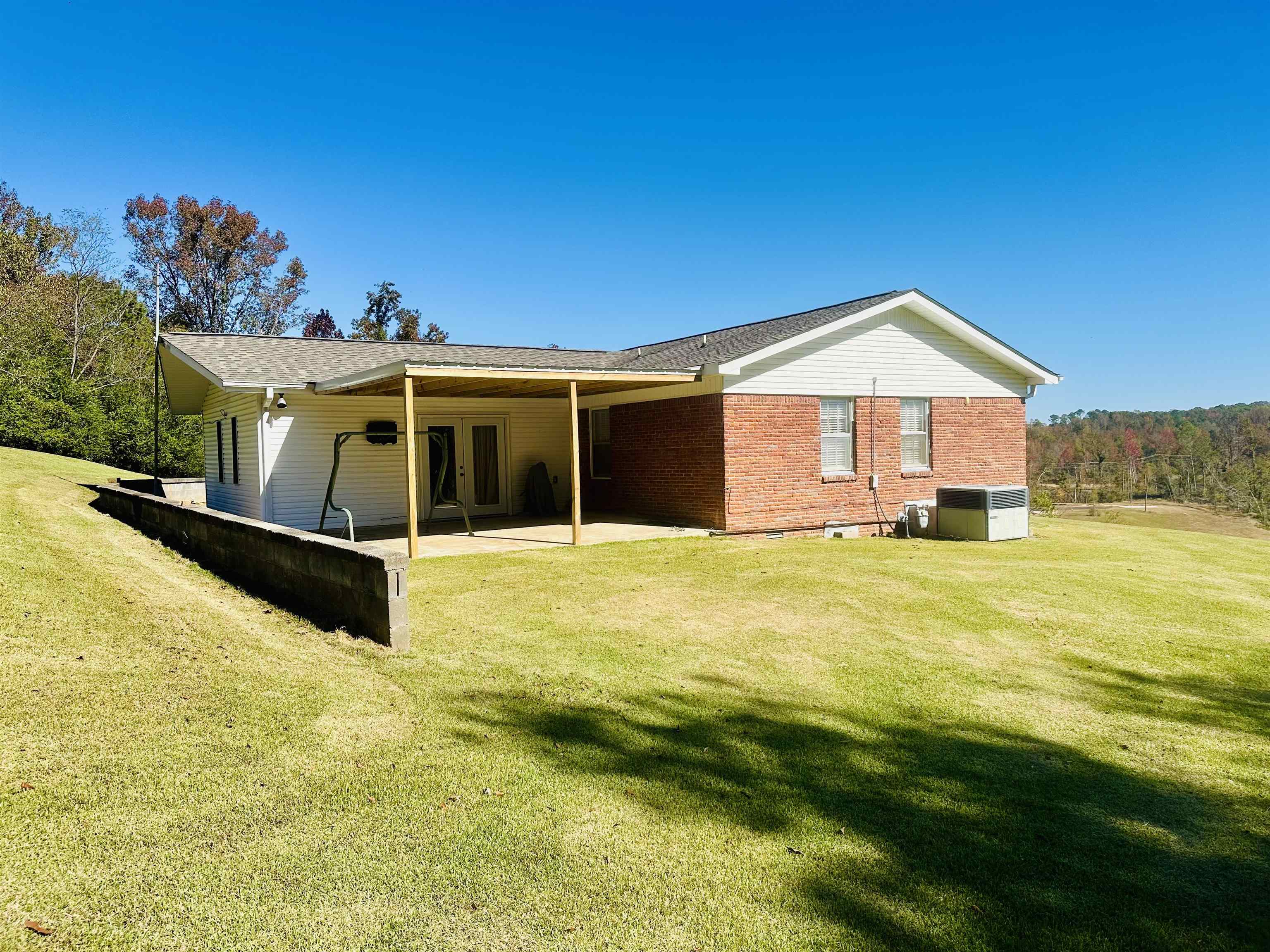 136 Perkins Street Selmer, TN 38375 - Photo 19 of 25 a front view of a house with a yard