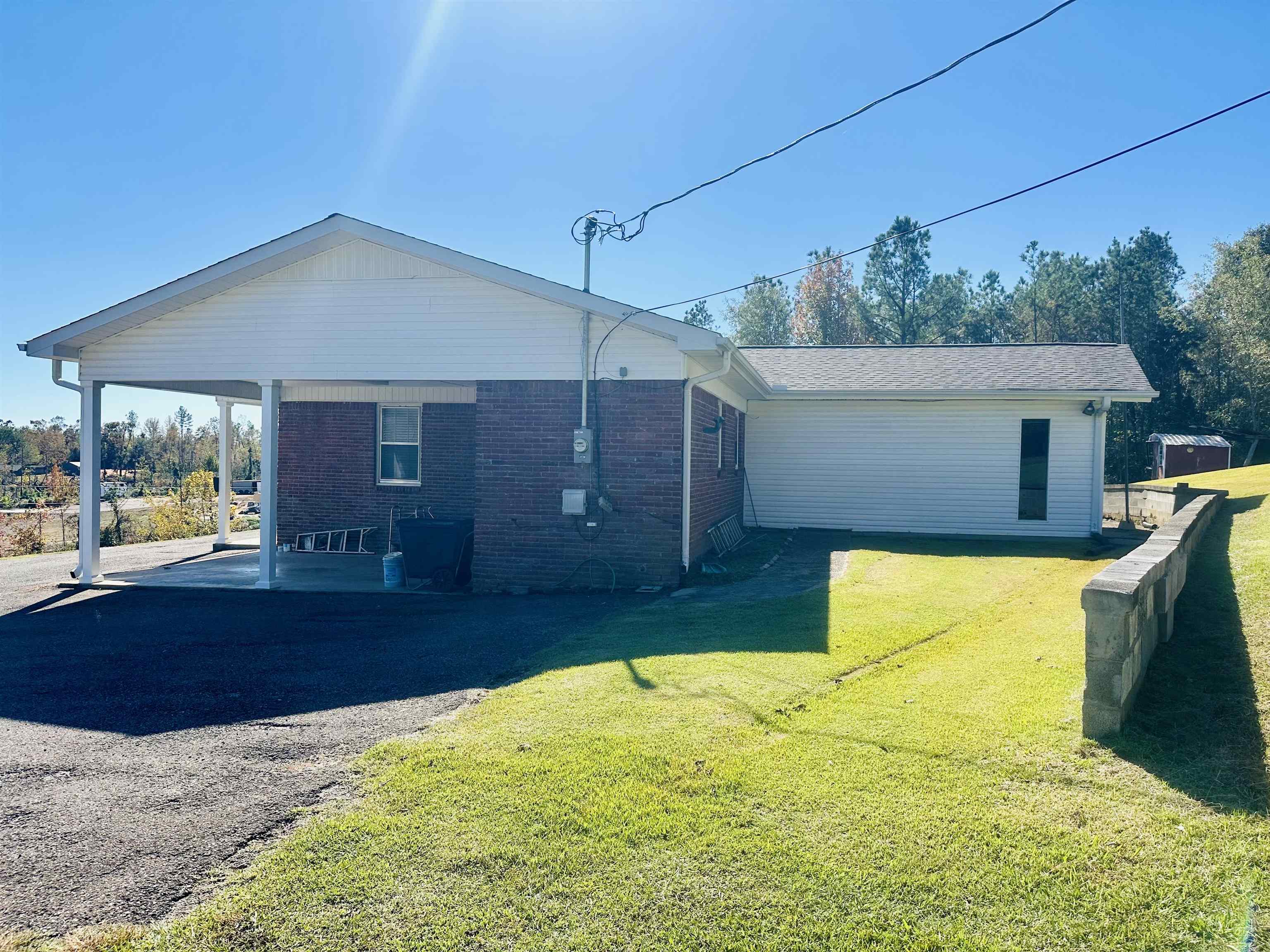 136 Perkins Street Selmer, TN 38375 - Photo 22 of 25 a view of a house with backyard