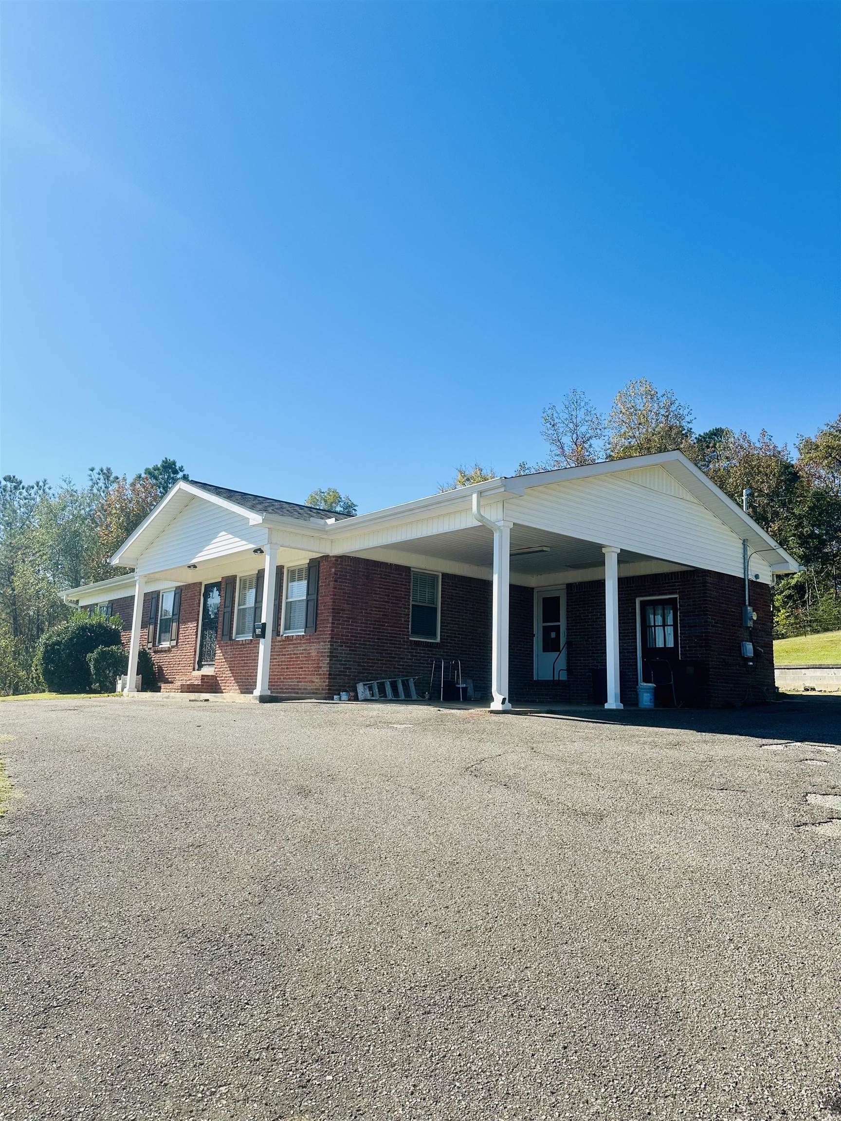 136 Perkins Street Selmer, TN 38375 - Photo 23 of 25 a front view of a house with a garden