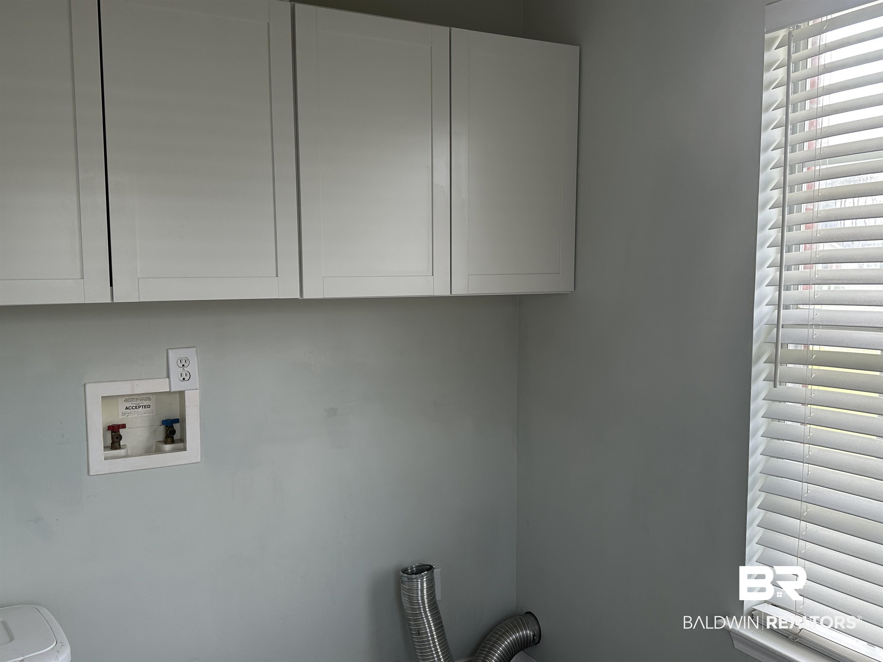 4882 Rebecca Place Mobile, AL 36695 - Photo 7 of 29 Clothes washing area with cabinet space and hookup for a washing machine