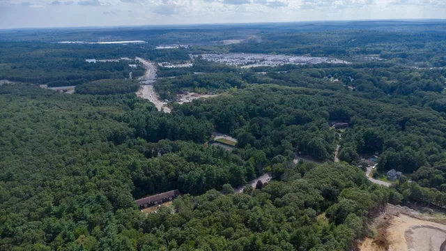 an aerial view of residential house and green space