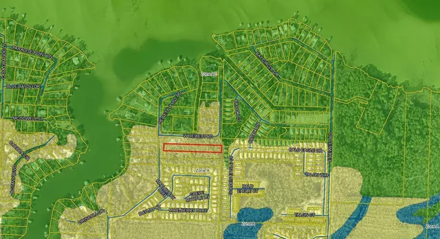 a green field with lots of tress in front of it