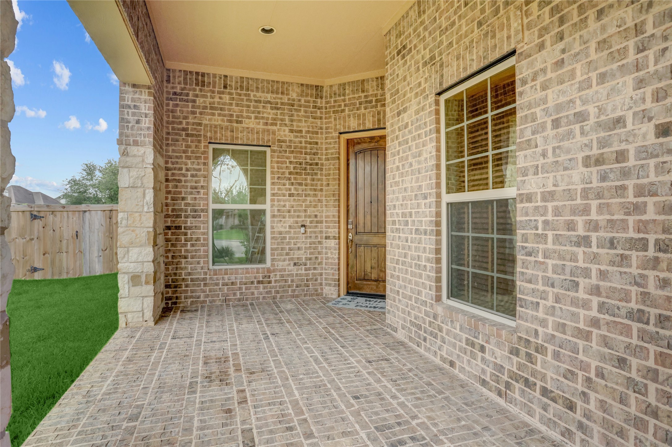 3002 Currant Drive Manvel, TX 77578 - Photo 4 of 43 a view of a brick house with a large window