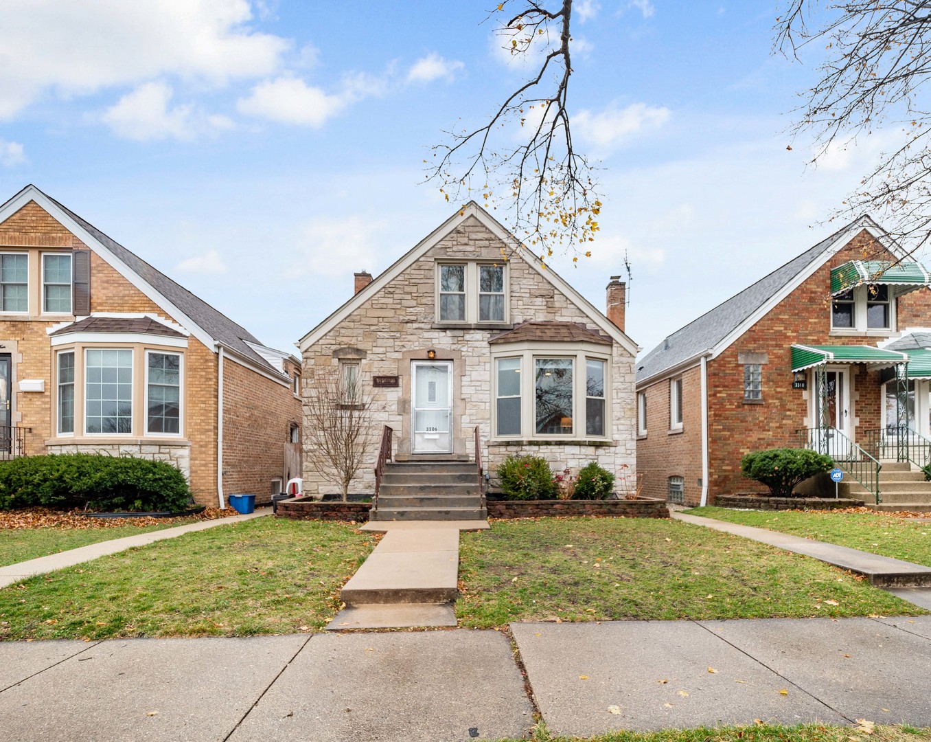 3306 North Nottingham Avenue Chicago, IL 60634 - Photo 1 of 25 a front view of a house with a yard