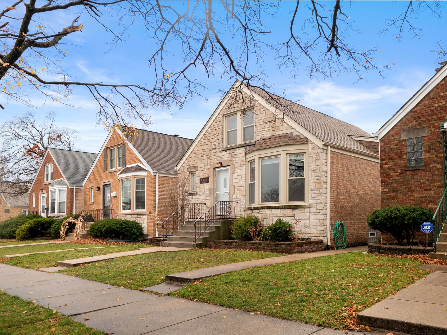 3306 North Nottingham Avenue Chicago, IL 60634 - Photo 2 of 25 a front view of a house with a yard