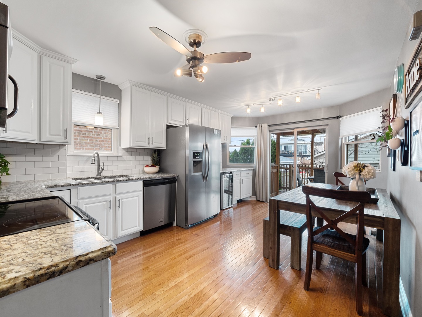 3306 North Nottingham Avenue Chicago, IL 60634 - Photo 11 of 25 a kitchen with refrigerator cabinets dining table and chairs