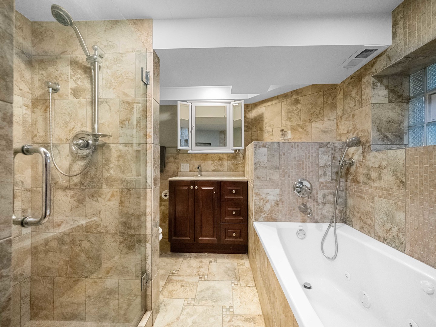 3306 North Nottingham Avenue Chicago, IL 60634 - Photo 18 of 25 a bathroom with a granite countertop bathtub shower sink and mirror