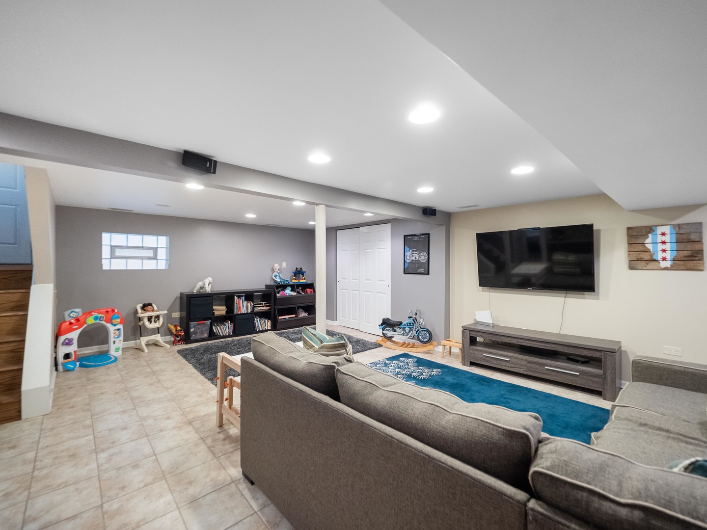 3306 North Nottingham Avenue Chicago, IL 60634 - Photo 19 of 25 a living room with furniture and a flat screen tv