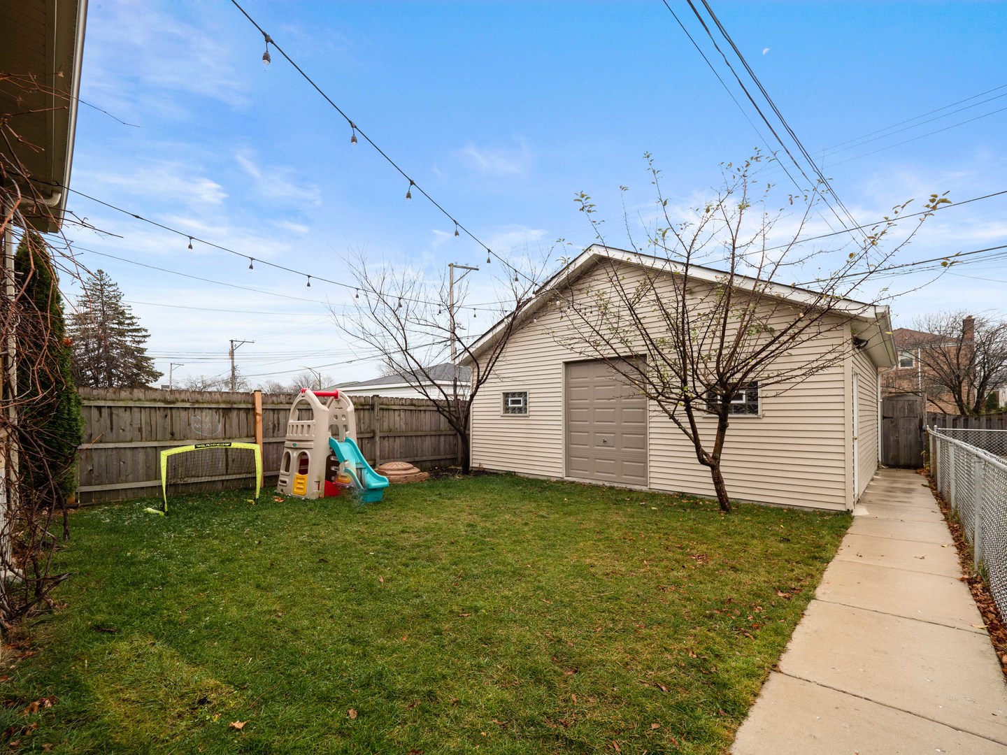 3306 North Nottingham Avenue Chicago, IL 60634 - Photo 24 of 25 a view of a house with a yard