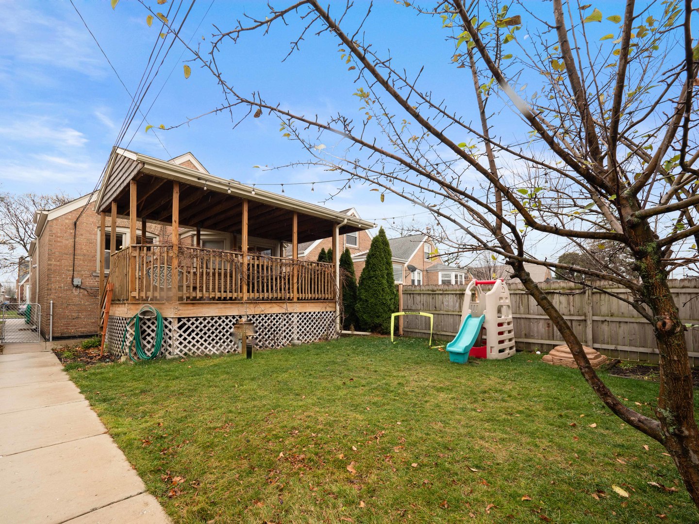 3306 North Nottingham Avenue Chicago, IL 60634 - Photo 25 of 25 a view of a house with a yard