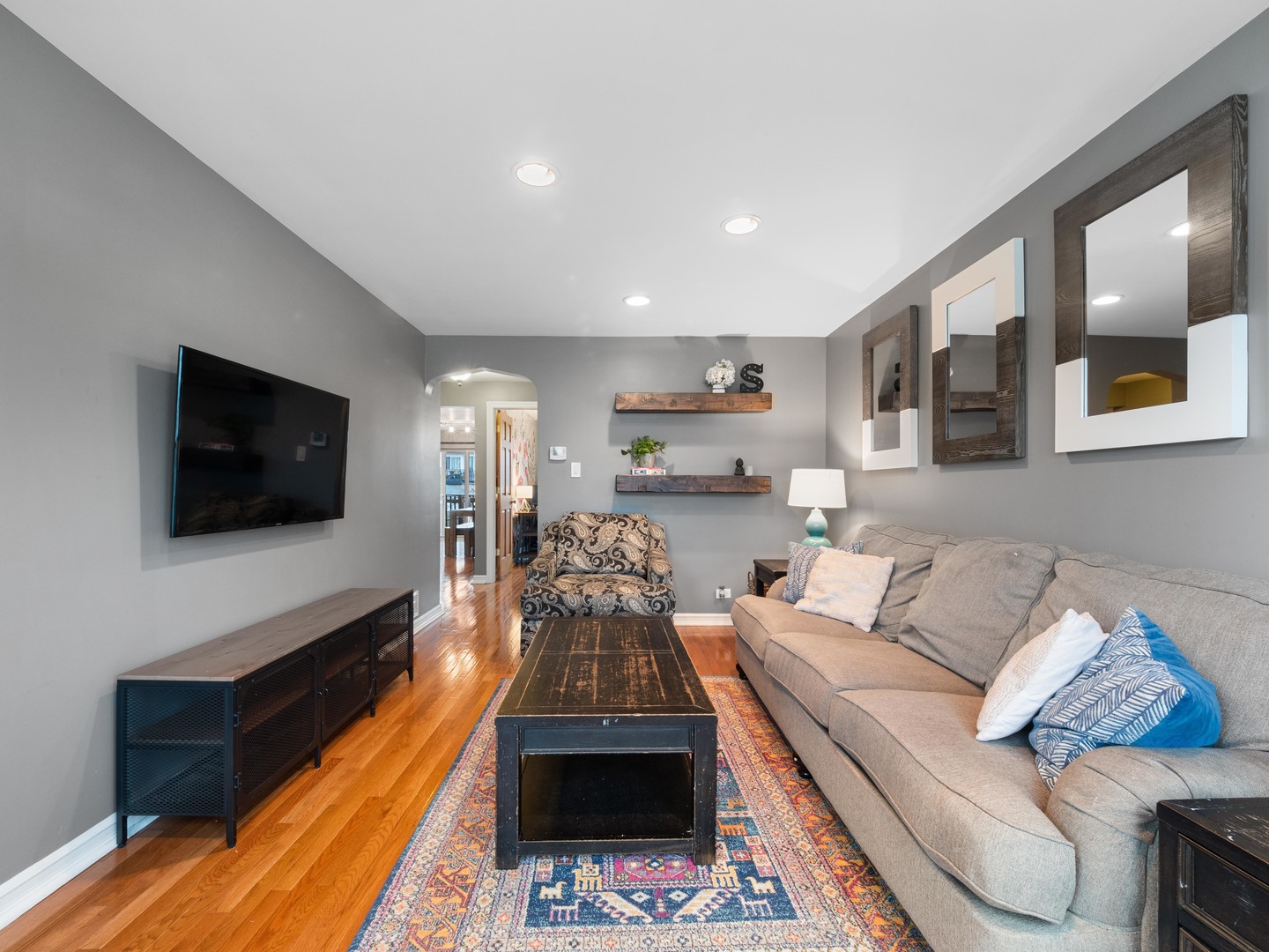 3306 North Nottingham Avenue Chicago, IL 60634 - Photo 4 of 25 a living room with furniture and a flat screen tv