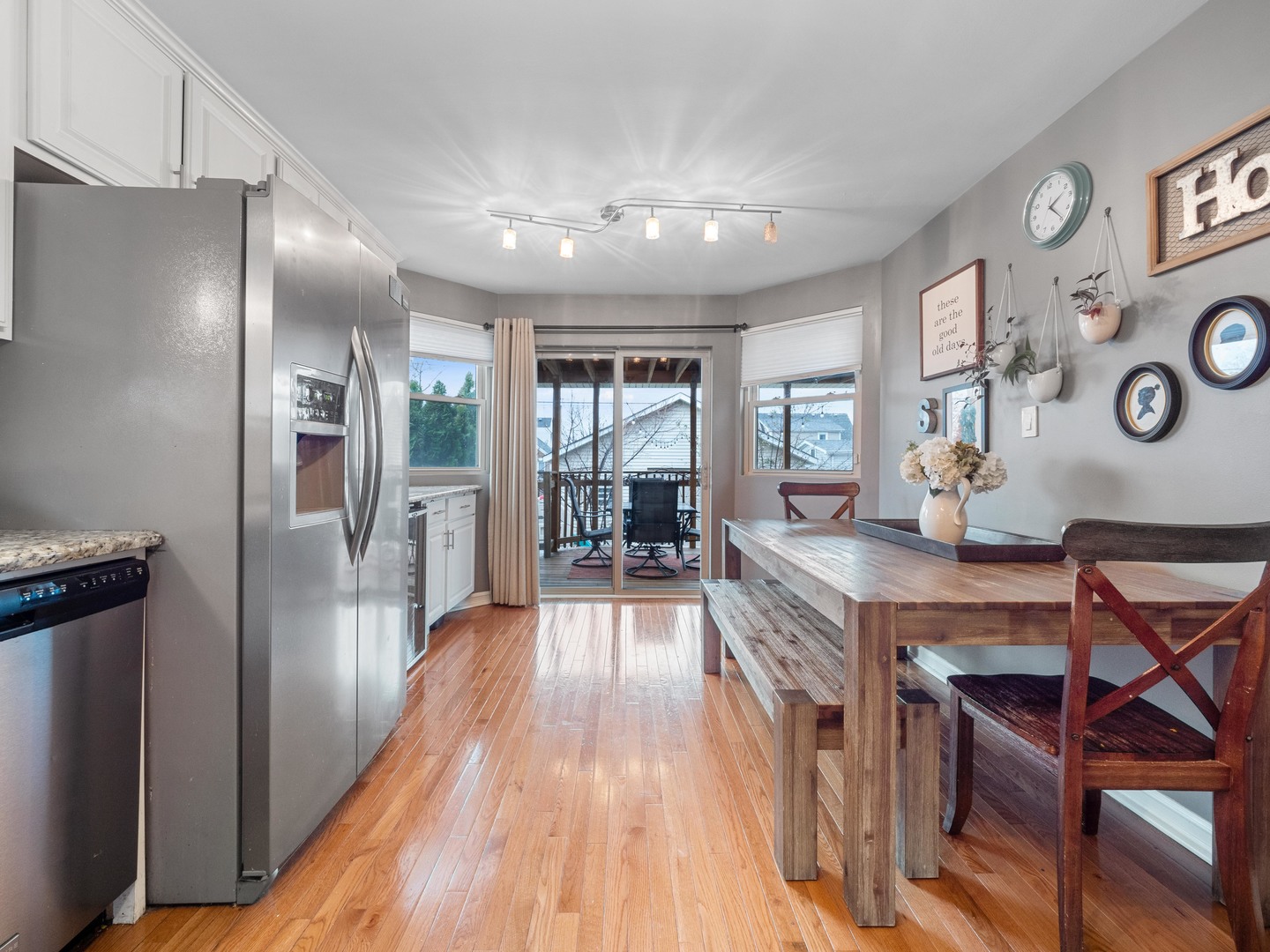 3306 North Nottingham Avenue Chicago, IL 60634 - Photo 9 of 25 a kitchen with stainless steel appliances granite countertop a refrigerator a stove and a wooden floors