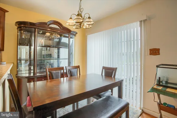 a view of a dining room with furniture and window