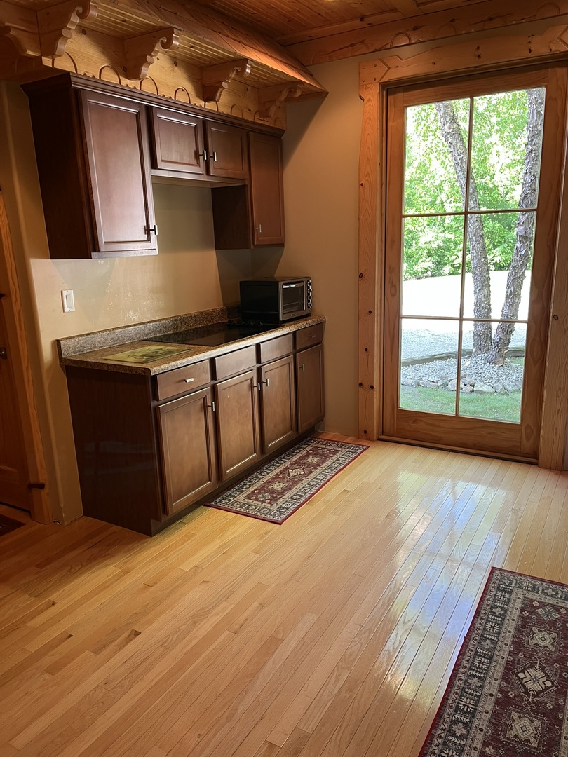 423 Mallard Point Drive Danville, IL 61834 - Photo 12 of 40 a kitchen with stainless steel appliances granite countertop a sink and a stove