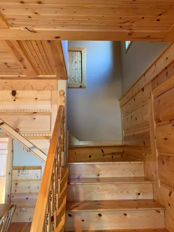 a bedroom with a bed and a chair