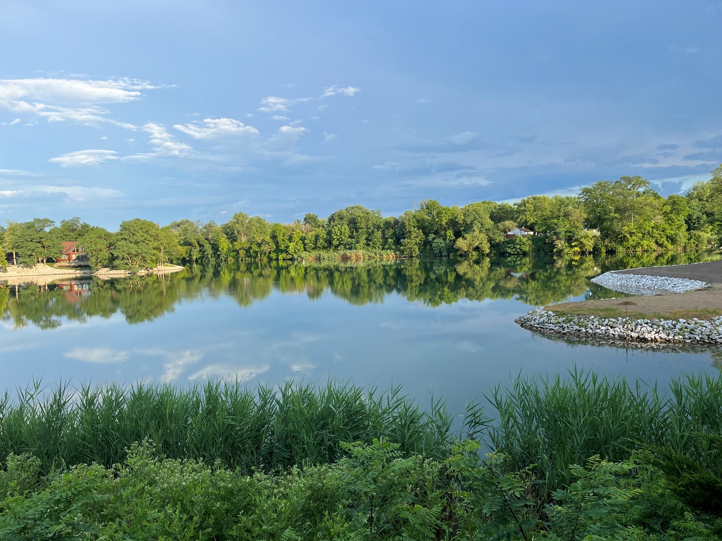 423 Mallard Point Drive Danville, IL 61834 - Photo 29 of 40 a view of a lake with houses in the back